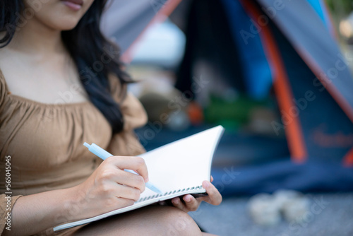 Woman writing diary or idea work on notebook