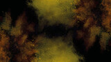Abstract yellow and brown explosion isolated on black background. Beautiful explosion of colored powder on black background. Concept of spice