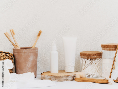 Bath background front view with straw box, container with toothbrushes, cosmetics