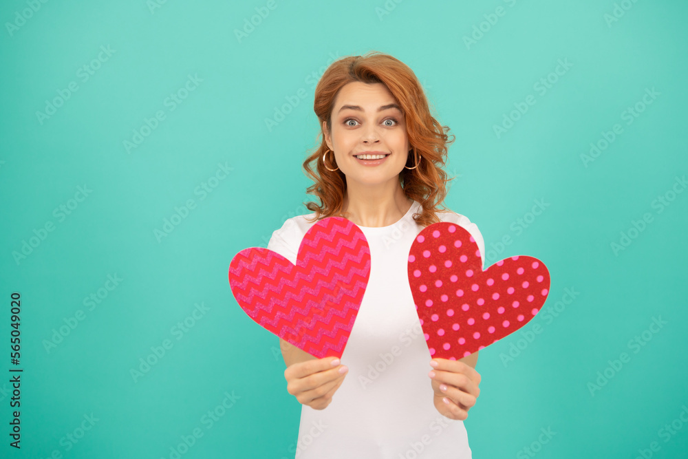 romantic present. young girl with red heart on blue background romantic present. young girl with red heart on blue background