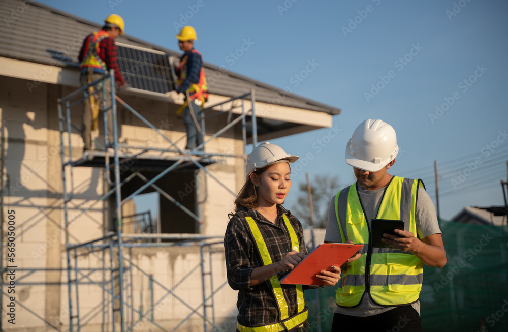 A team of expert engineering and construction worker is evaluating the realization on the construction site. For their own safety, all members have yellow vests and hard hats. A team of expert engineering and construction worker is evaluating the realization on the construction site. For their own safety, all members have yellow vests and hard hats.