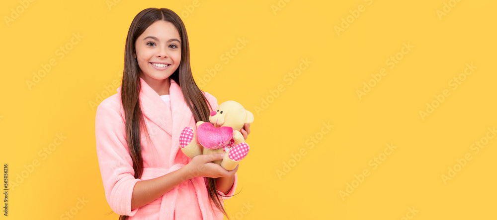Φωτογραφία happy teen girl in home terry bathrobe with toy, happiness