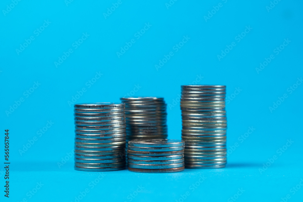Coins on a blue background. Business and finance concept Coins on a blue background. Business and finance concept
