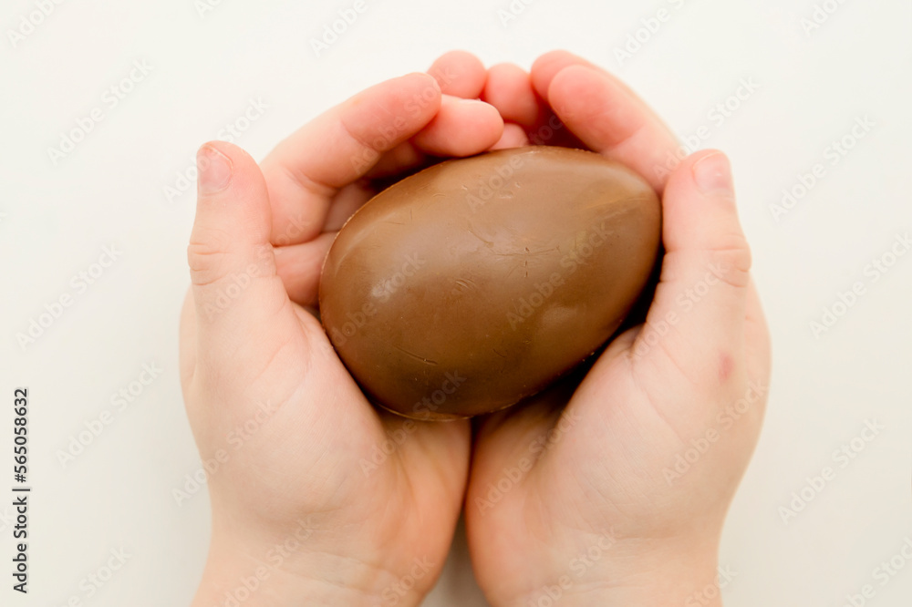 Celebrating Easter with a chocolate egg. Happy family vacation. Celebrating Easter. Happy family vacation.
Celebrating Easter with a chocolate egg. Happy family vacation. Celebrating Easter. Happy family vacation.