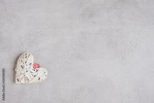 White handmade heart on gray background. Valentine's Day. Banner. Copy space.