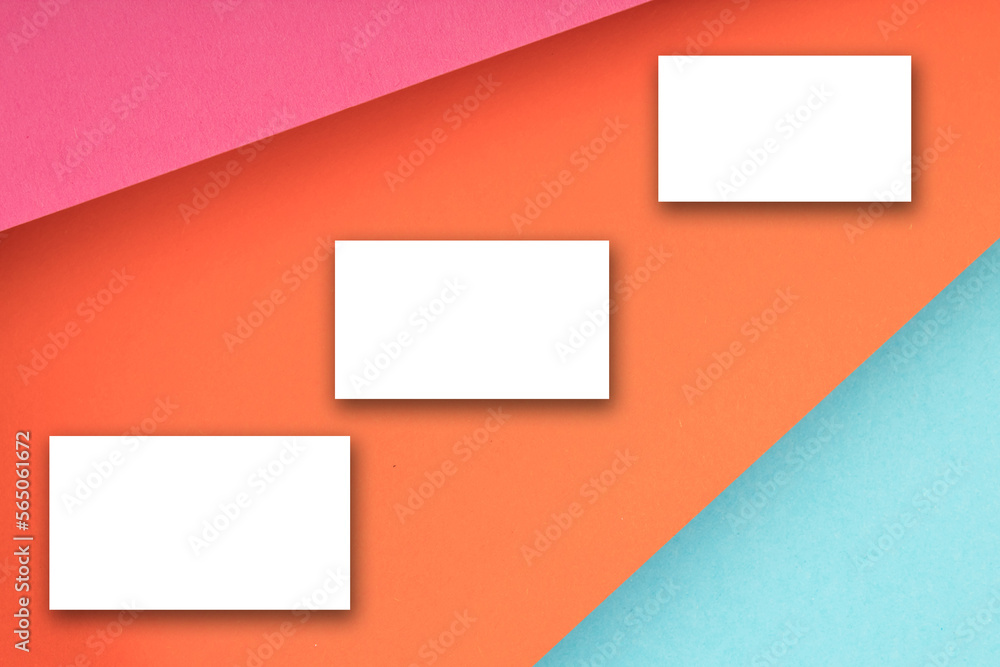 Business card blank over colorful background. Copy space for text. Top view.Business card blank over colorful abstract background. Corporate stationery branding mock-up. Copy space for text. Top view.