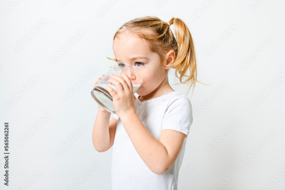Image of child drinking milk on white background