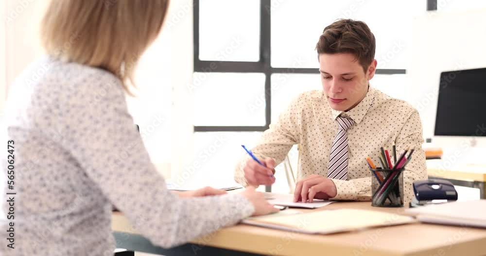 Manager giving contract to specialist for signing 4k movie Manager giving contract to specialist for signing 4k movie
