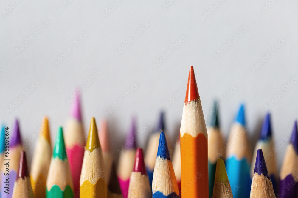 One pencil standing out from a group of other pencils One pencil standing out from a group of other pencils