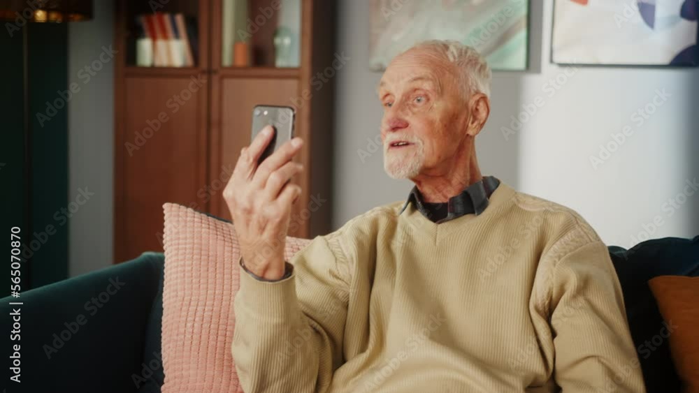 Senior aged elderly man communicating video chat, chatting and talking speaking family or friends online, staying at home during coronavirus lockdown quarantine. Video conference call by phone. Senior aged elderly man communicating video chat, chatting and talking speaking family or friends online, staying at home during coronavirus lockdown quarantine. Video conference call by phone.