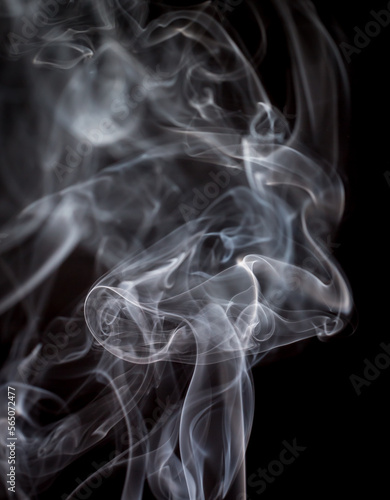 Fototapeta Naklejka Na Ścianę i Meble -  Abstract flash shot of smoke tendrils which lights the depth of the smoke perfectly. Background.