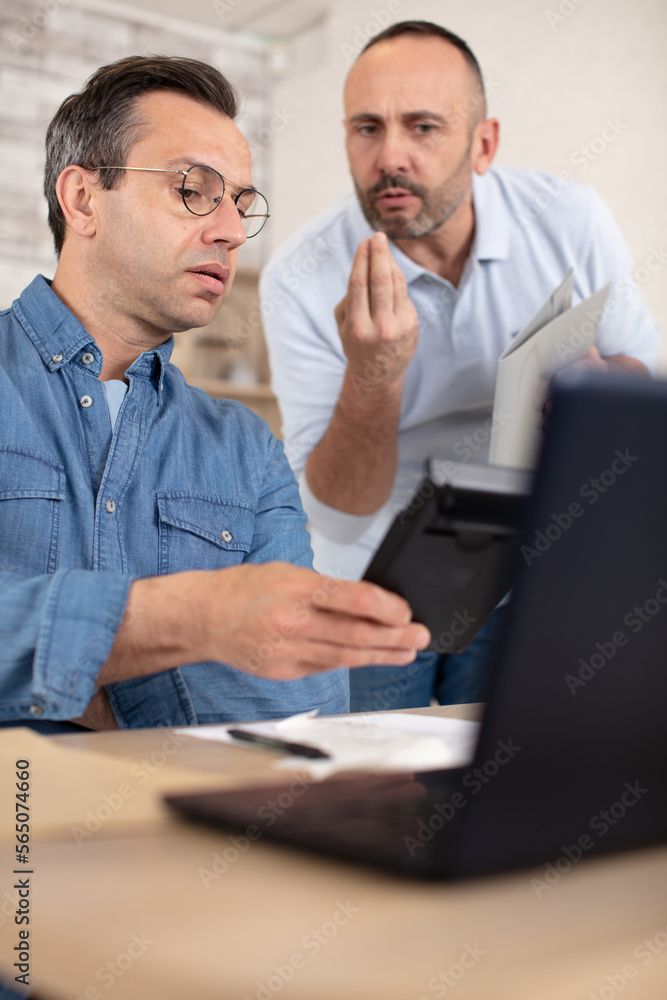 portrait of two designers discussing a project portrait of two designers discussing a project