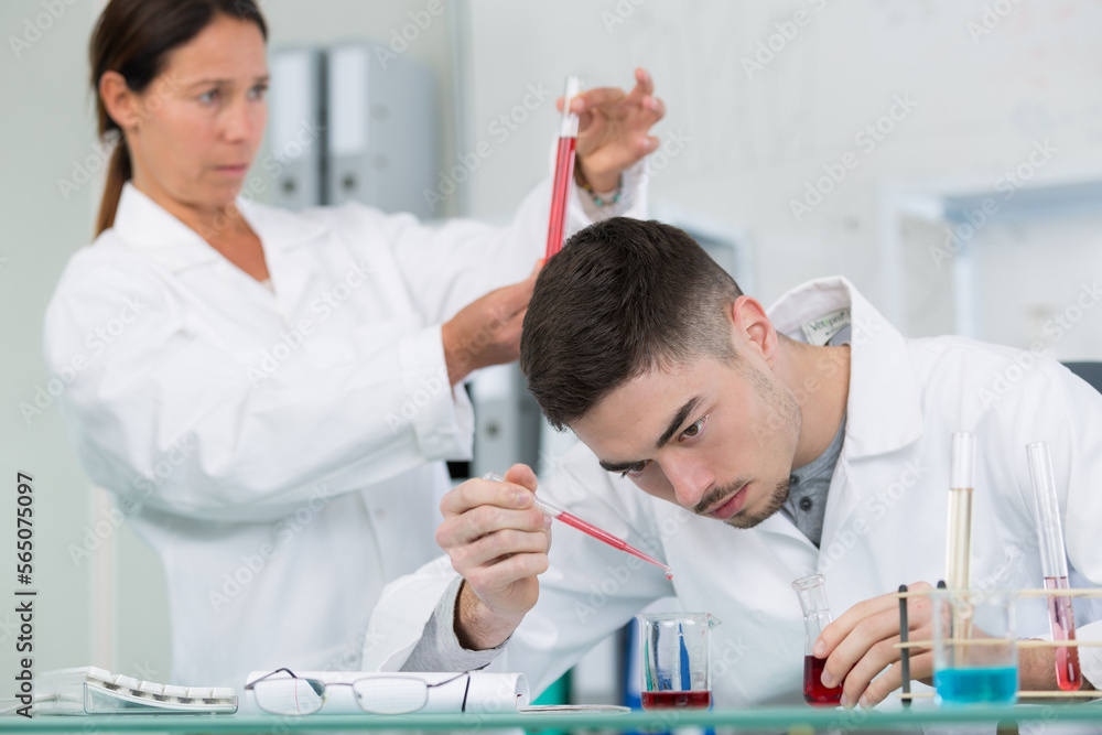 male and female scientists at work in lab male and female scientists at work in lab