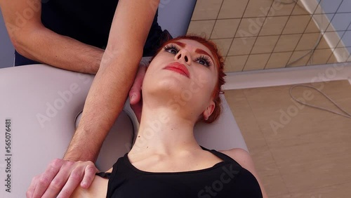 physiotherapist working on the patient's arms and neck- Phisiotherapy session photo