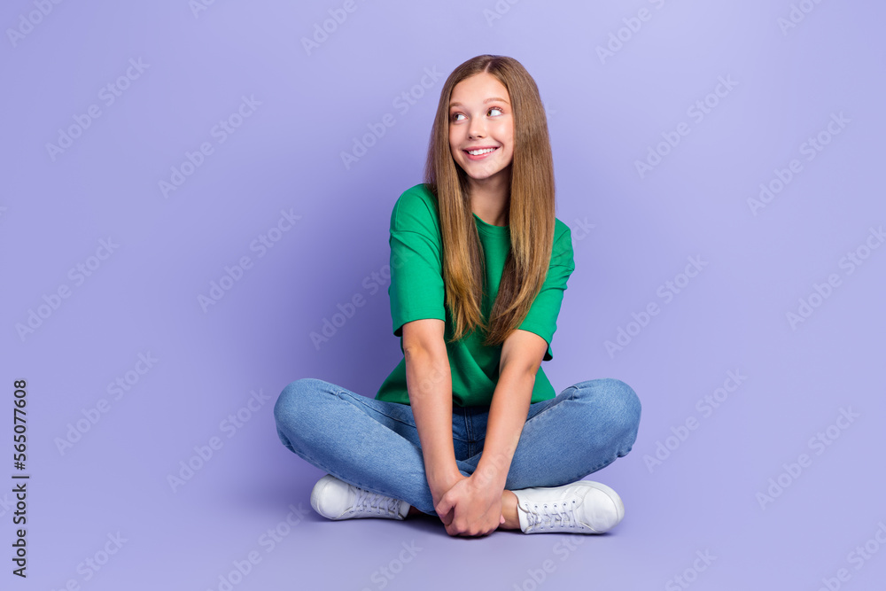 Photo of pretty lovely lady schoolkid sitting floor interested look empty space novelty cool offer isolated on purple color background