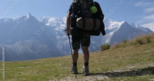 Senderista contemplando el macizo del Mont Blanc photo