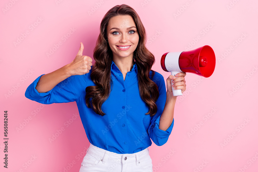 Photo of optimistic nice woman with curly hairdo dressed blue blouse hold megaphone showing like isolated on pink color background Photo of optimistic nice woman with curly hairdo dressed blue blouse hold megaphone showing like isolated on pink color background