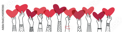 Hand up holding a heart in their hand.