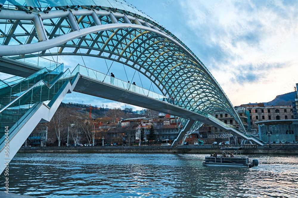Tourist landmark Peace Bridge over the Mtkvari River in the city of Tbilisi