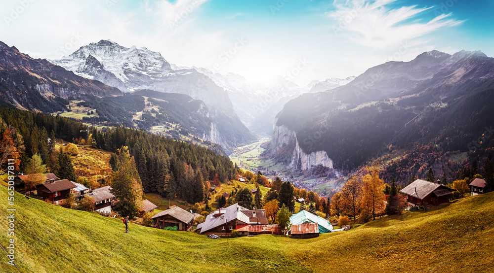 Panorama view of alpine Lauterbrunnen valley, Europe. Impressively beautiful Fairy-tale mountain landscape in Alps. Popular travel destination. Concept of an ideal resting place. Wengen in Switzerland Panorama view of alpine Lauterbrunnen valley, Europe. Impressively beautiful Fairy-tale mountain landscape in Alps. Popular travel destination. Concept of an ideal resting place. Wengen in Switzerland