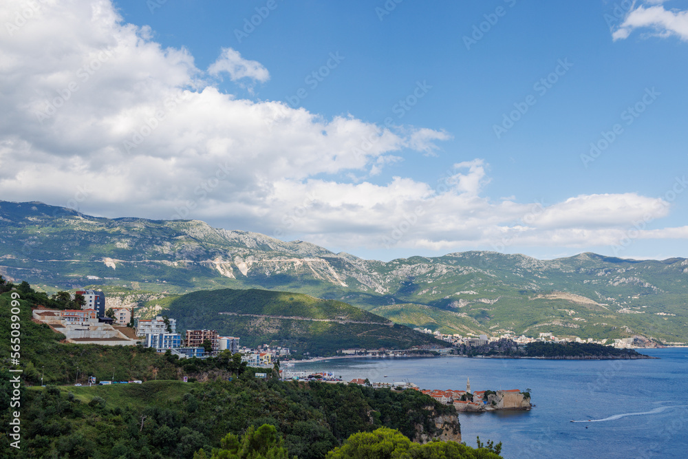 Bird's eye view of towns of Budva and Becici with hotels and beaches near Adriatic Sea against the backdrop of the Montenegrin Mountains