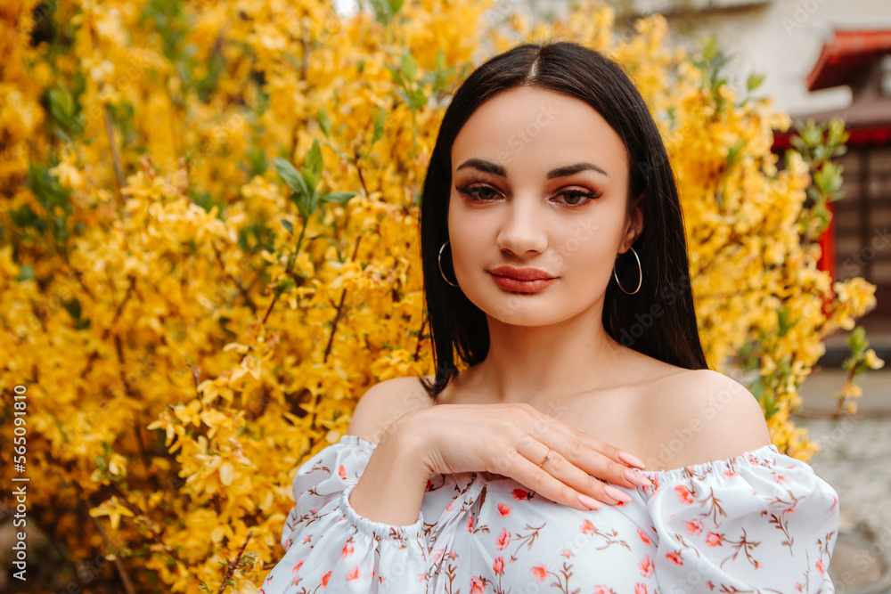 Portrait of beautiful tender woman dressed pink flowery dress posing near yellow forsythia tree blossoms blooming flowers in the garden park in early spring
Portrait of beautiful tender woman dressed pink flowery dress posing near yellow forsythia tree blossoms blooming flowers in the garden park in early spring