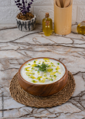 Tzatziki  - Kitchen Concept, Traditional Greek and Turkish Yogurt Sauce in a Bowl on Marble Background. photo