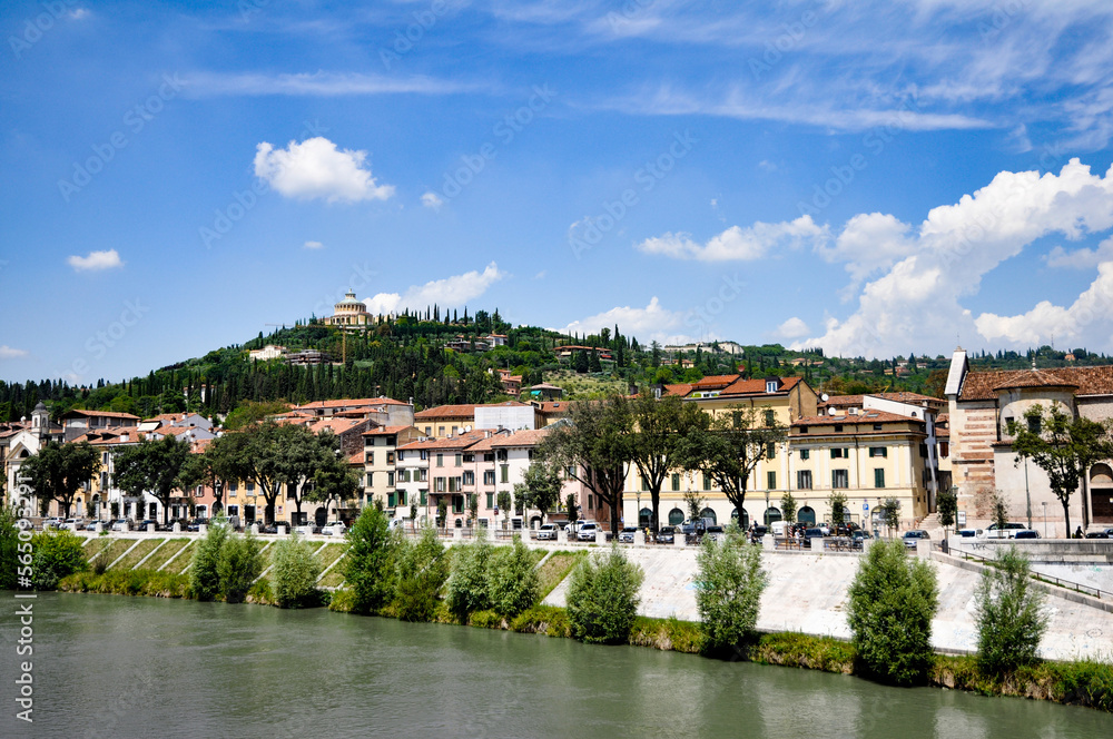 view of the river and shore and hill in Verona