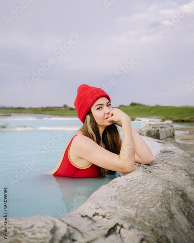 The girl bathes in a natural hot spring in Georgia photo