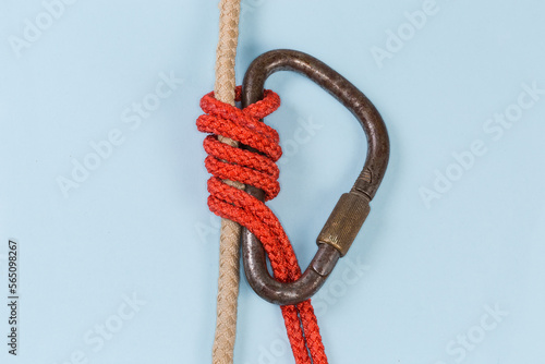 Fotografie Rope Bachmann knot on a blue background