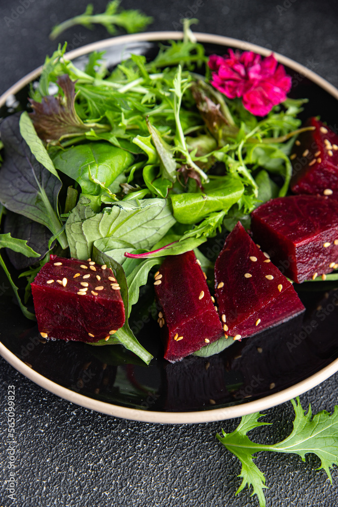 beet salad beetroot pieces mix green lettuce healthy meal food snack on the table copy space food background rustic top view