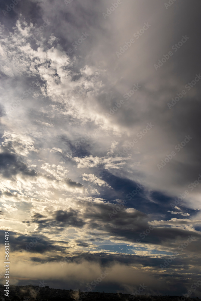 Fototapeta premium Dramatic sunset in the Sky through cumulus storm clouds, Timelapse. Awesome epic landscape. Amazing vibrant colors, in Brazil