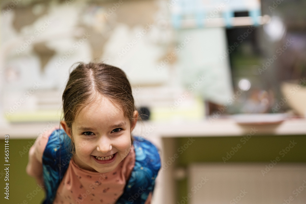 Young lovely baby girl with a big backpack in the interior of room. Getting ready for school. Young lovely baby girl with a big backpack in the interior of room. Getting ready for school.