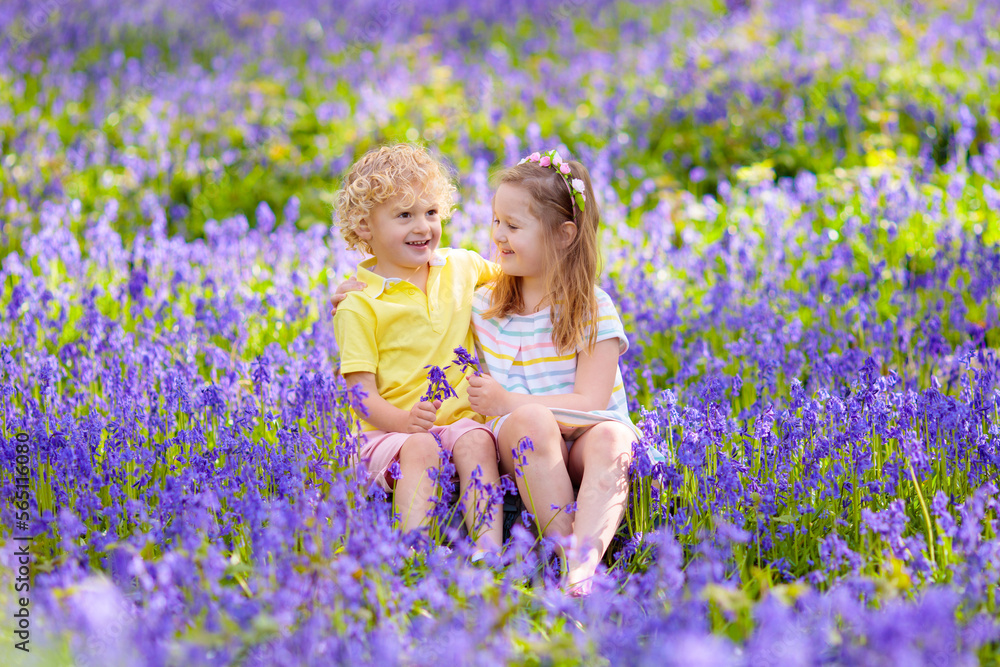Kids playing in bluebell woods Kids playing in bluebell woods