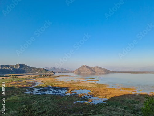 Panoramic view of Lake Skadar National Park in autumn seen from Virpazar, Bar, Montenegro, Balkans, Europe. Travel destination in Dinaric Alps near the Albanian border. Stunning landscape and nature © Chris