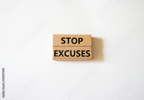 Stop excuses symbol. Concept words Stop excuses on wooden blocks. Beautiful white background. Business and Stop excuses concept. Copy space.