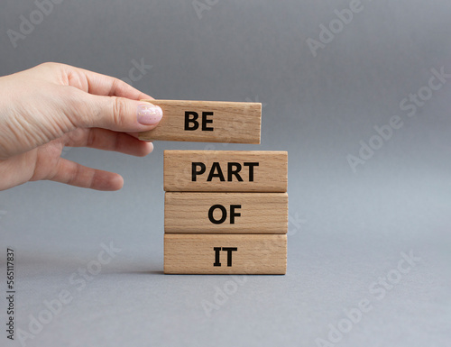 Be part of it symbol. Concept words Be part of it on wooden blocks. Beautiful grey background. Businessman hand. Business and Be part of it concept. Copy space.