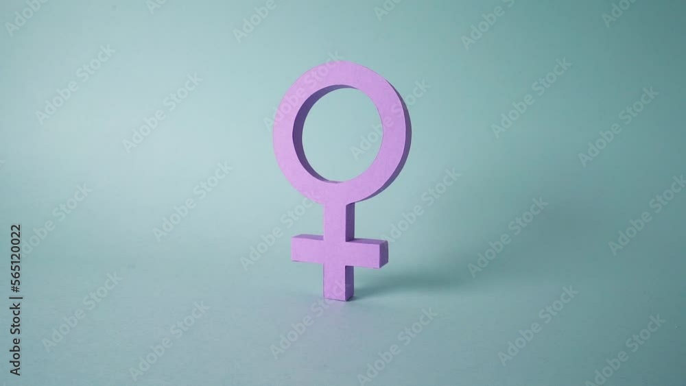 Women's day: 3D Purple female gender symbol made of paper cut out, woman sex icon papercraft handmade for feminism. Zoom Out in Slow Motion Women's day: 3D Purple female gender symbol made of paper cut out, woman sex icon papercraft handmade for feminism. Zoom Out in Slow Motion