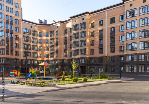 New residential neighbourhood with typical simple buildings. Affordable housing. Mortgage for young families