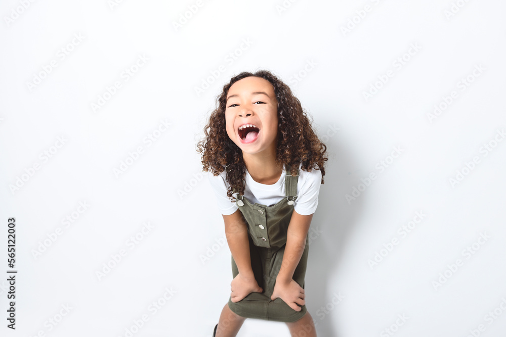 Adorable black little girl with beautiful curly hairstyle isolated over white Adorable black little girl with beautiful curly hairstyle isolated over white