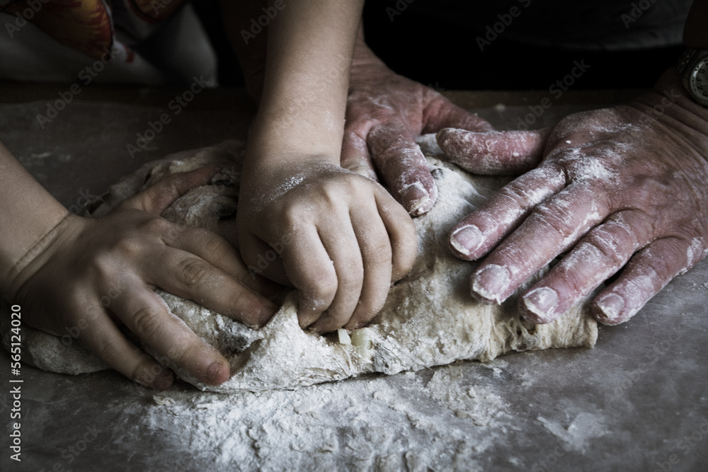 hands baking bread together hands baking bread together