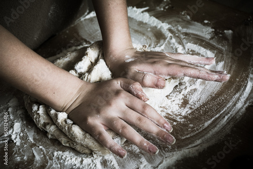 hands baking bread together