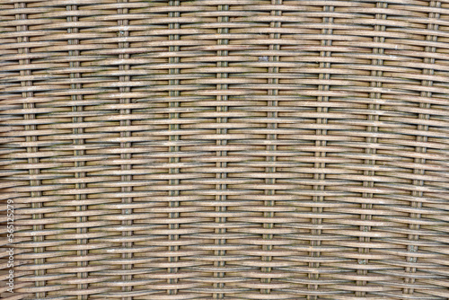 Abstract brown wicker basket texture background. Handmade wavy pattern made from reed stems. Copy space for your text or decoration. Wooden materials theme.