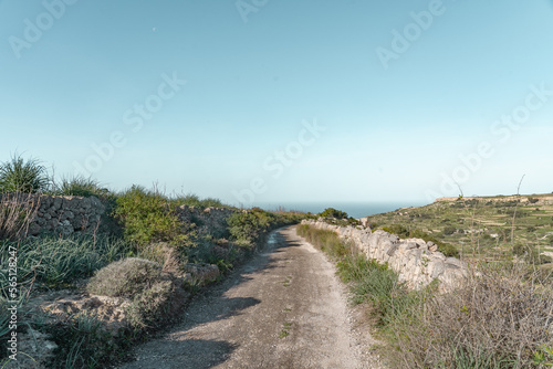 Peaceful farmroad leading to the mediterranean sea in Malta