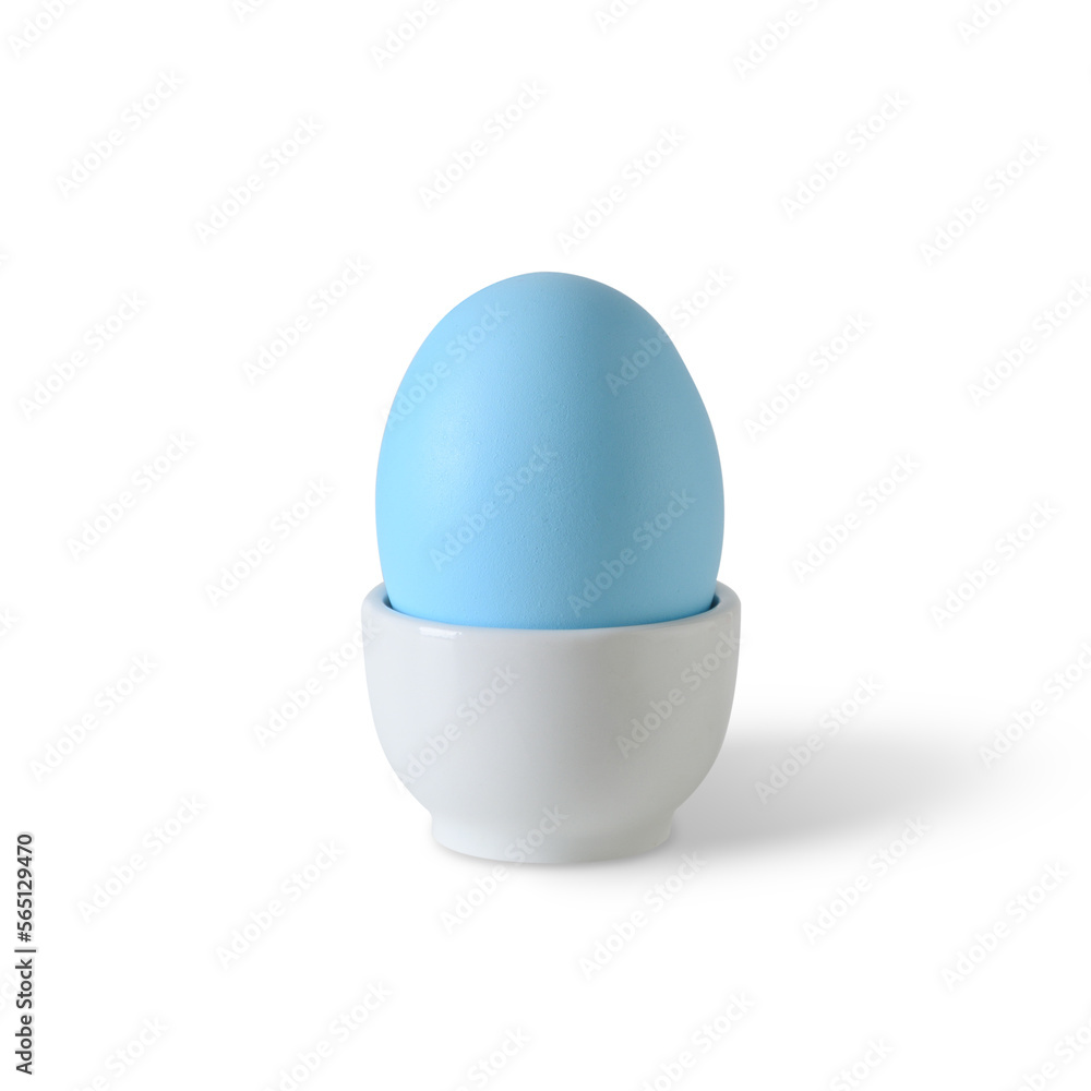 Easter one blue egg isolated in white porcelain stand on white background. Easter one blue egg isolated in white porcelain stand on white background.