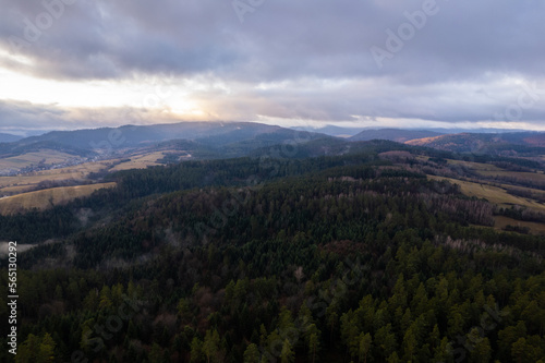 Bieszczady mountains. Cloudy sunrise in the mountains. Moody morning in the mountains. Sun through the clouds in the mountains. Sunrays in mountains.