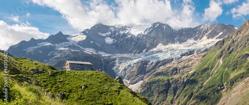 The massif of Grosses Fiescher horn peak and Berghaus Baregg chalet - Switzerland - Grindelwald.