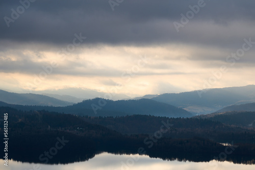 Bieszczady mountains. Cloudy sunrise in the mountains. Moody morning in the mountains. Sun through the clouds in the mountains. Sunrays in mountains.