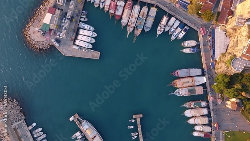 Aerial view of amazing boats. Marina bay. Top view from drone of harbor with yacht, motorboat and sailboat. Seascape