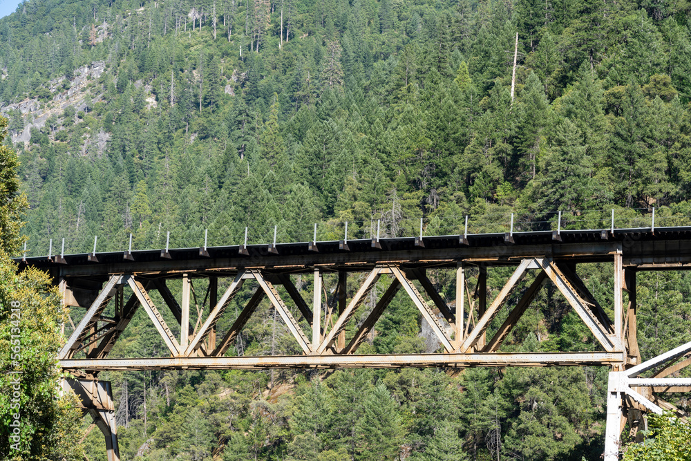 Close up view of the Merlin Railroad Bridge with the mountains in background located in the Plumas National Forest, California 